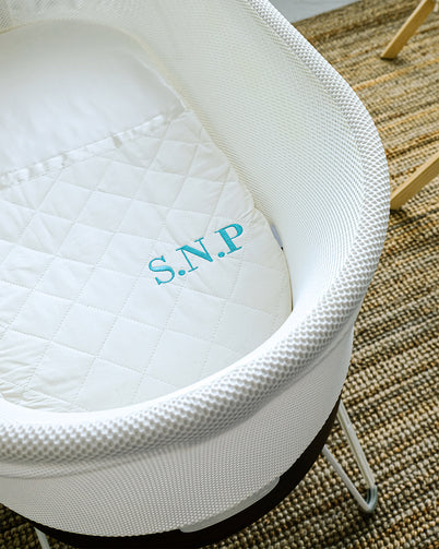 Snoo Bassinet by happiest baby featuring Silkzees fitted bassinet solution silk sheet. 100% mulberry silk to prevent baby balding. Monogrammed options available. Minimalist design nursery. 